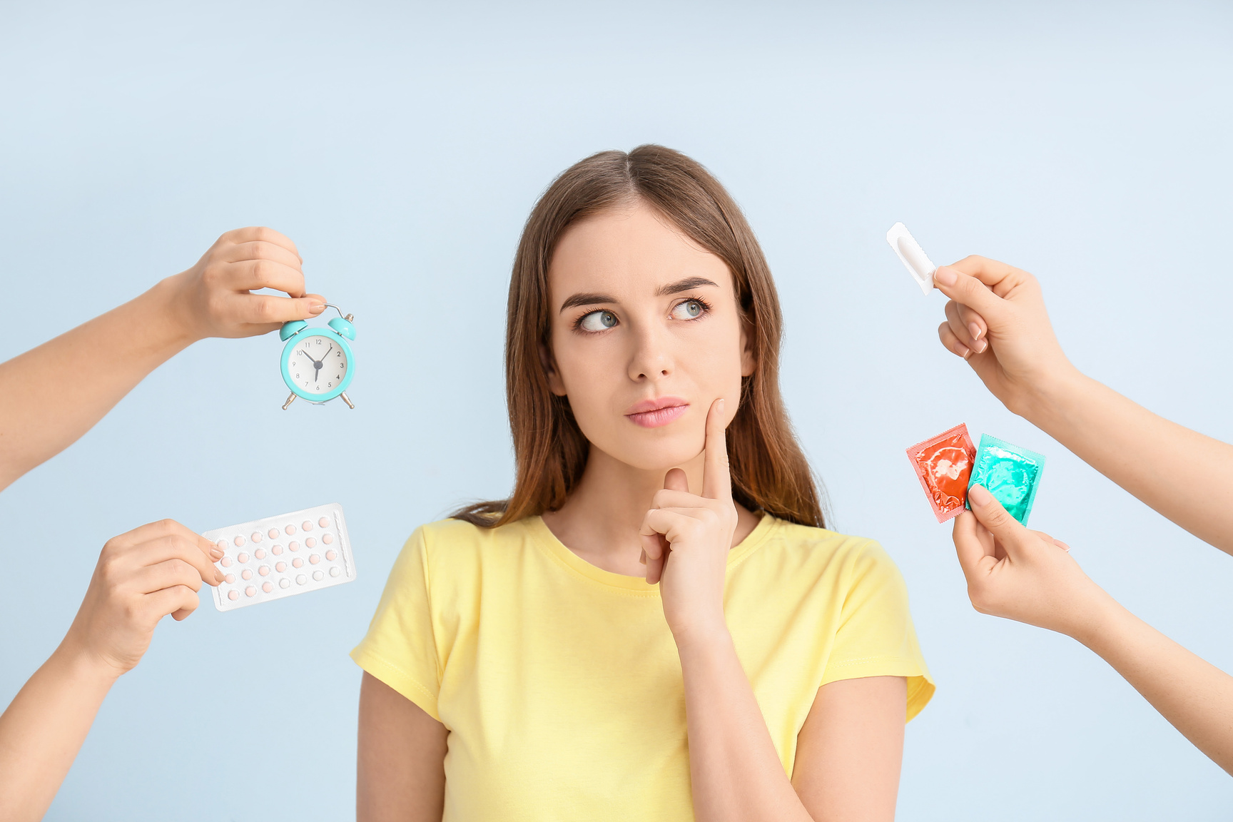 Thoughtful Woman and Hands with Different Contraceptive Methods