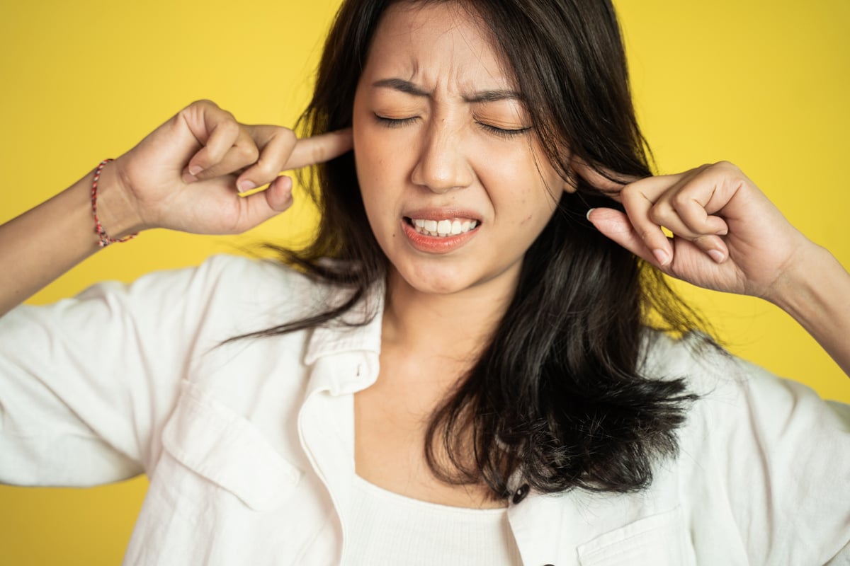 Asian Female Does Not Want to Hear Too Loud Noise