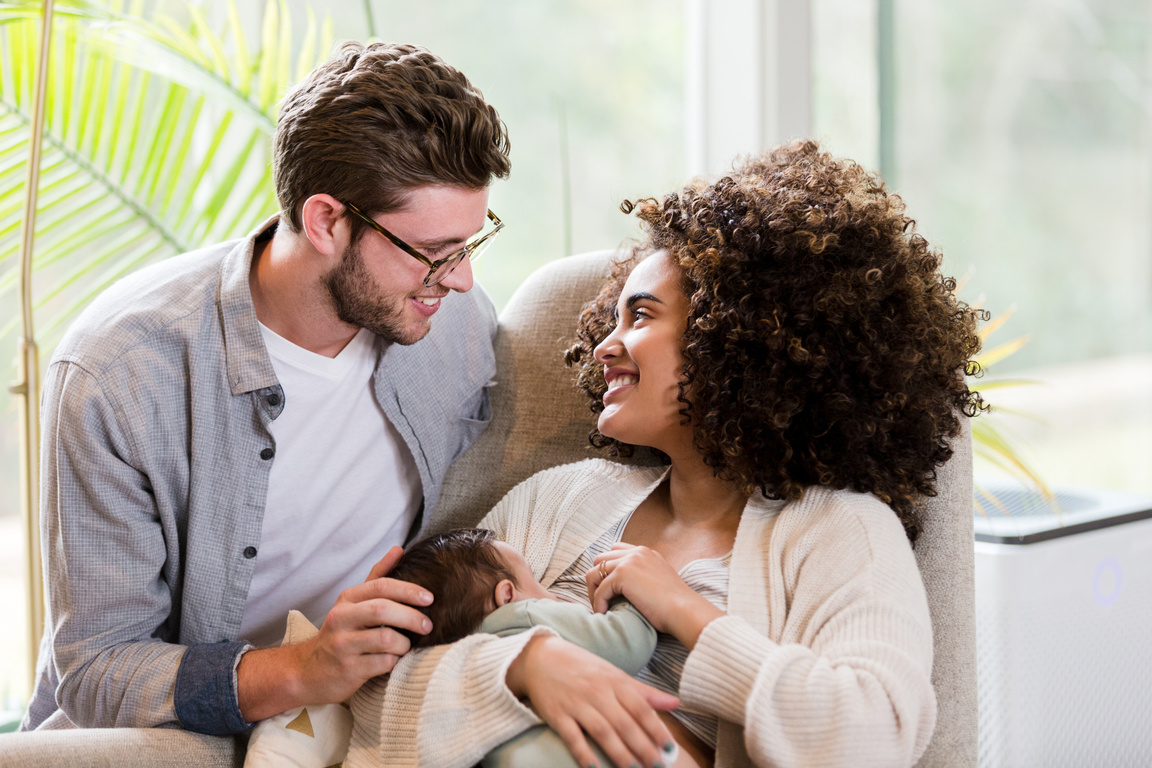 Happy new parents with baby