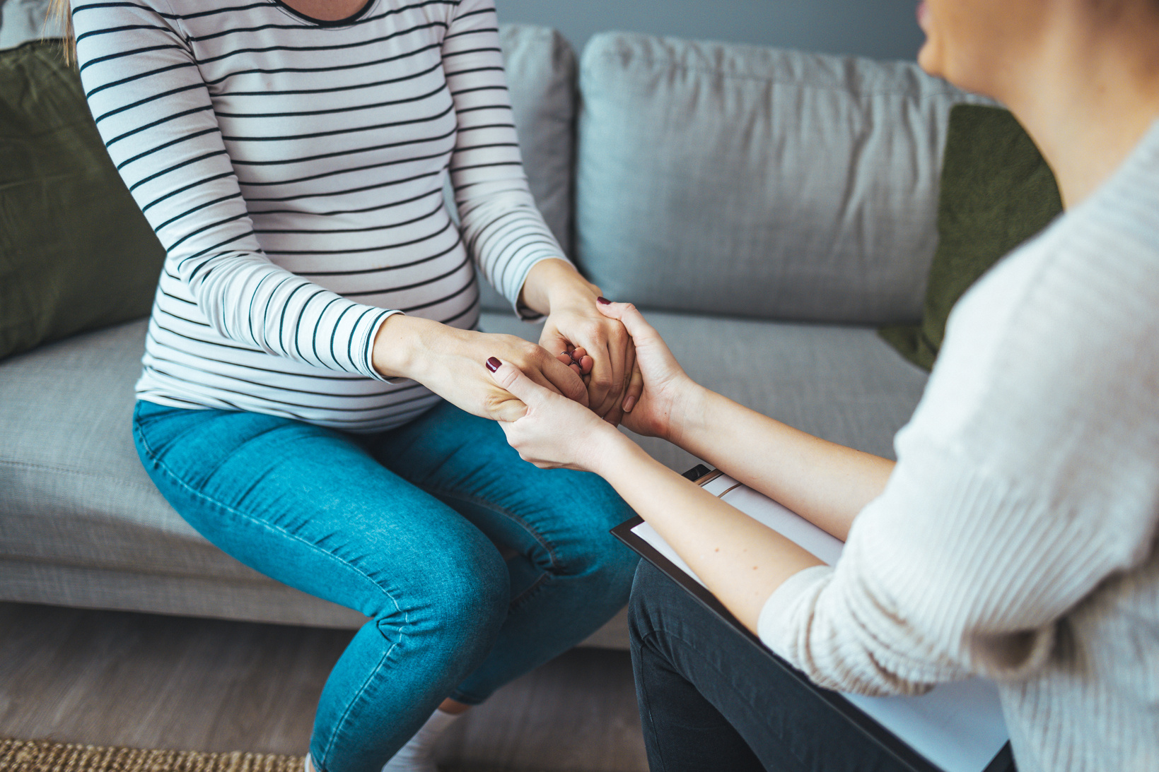 Pregnant support group meetup in a house.